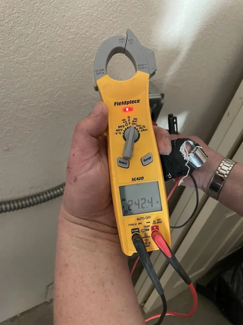 Voltage testing with clamp meter during Ceiling Fan Installation in Homewood